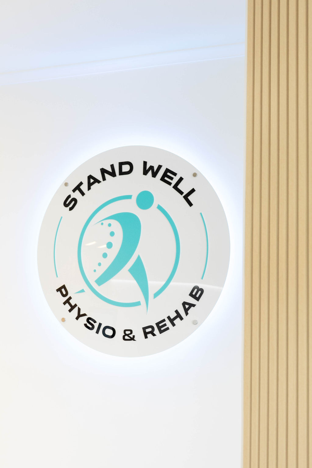 Stand Well Physio & Rehab logo wall